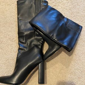 Black leather heeled knee high boots